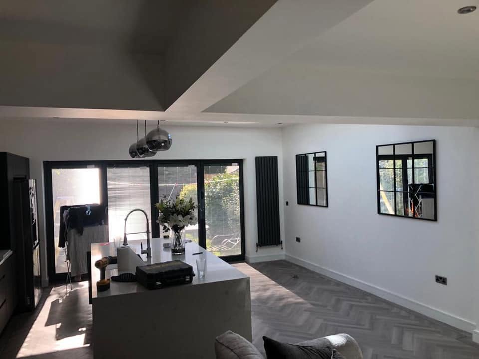 Open-plan kitchen extension with island, bi-fold doors and lantern roof