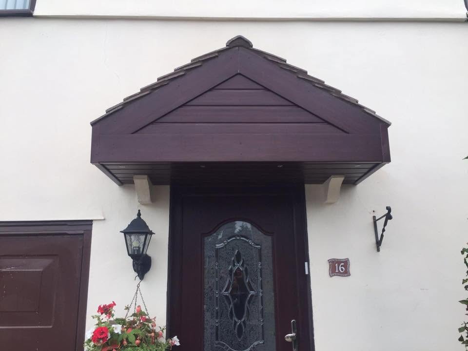Bespoke front porch canopy with arched detail — joinery by RG