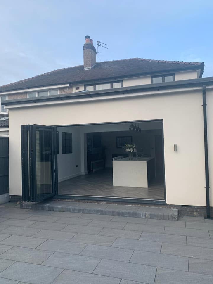 Rear bungalow extension with large bi-fold doors open to the garden